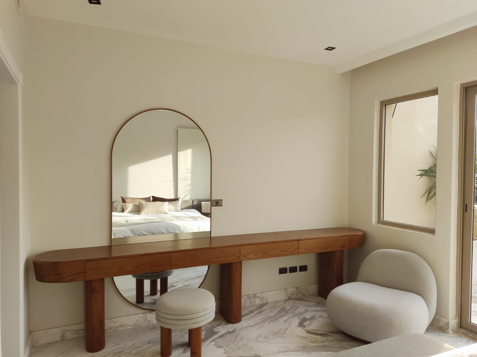 A floating walnut dressing table with an arched mirror delivered in New Cairo