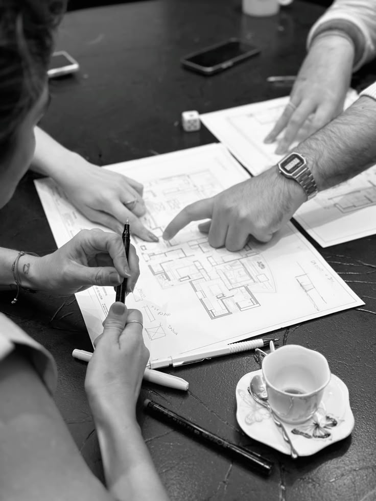 Designers working through a client's floor plan together